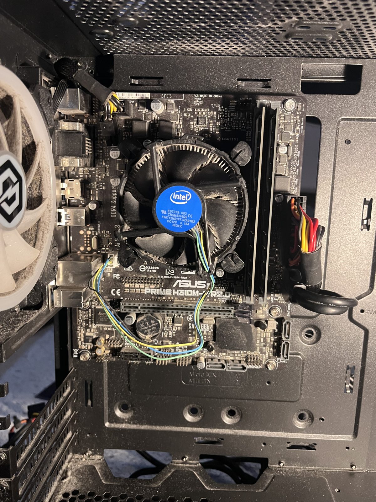 Motherboard fully fitted in the case with cooler and RAM installed